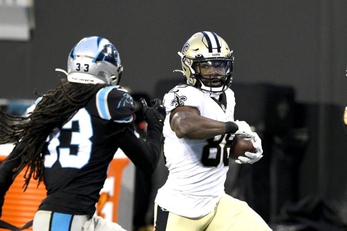 New Orleans running back Ty Montgomery (88) with the ball as Carolina safety Tre Boston (33) defends. Mandatory Credit: Bob Donnan-USA TODAY